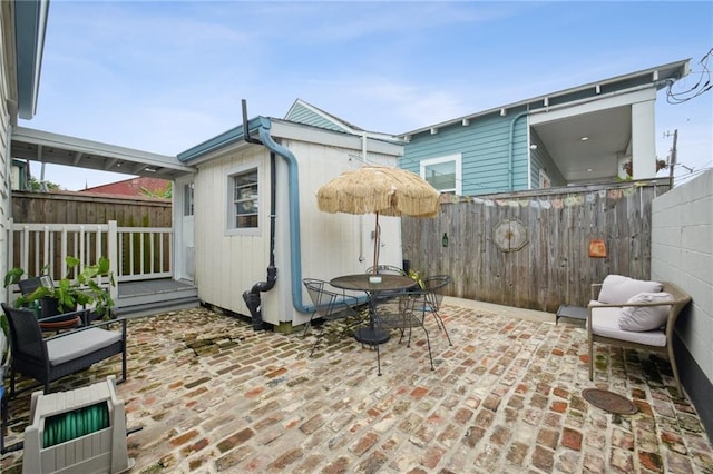 1131 N Roman St, New Orleans, LA 70116 - fenced backyard with a patio and outdoor dining space