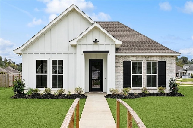 72701 Robindale Dr, Covington, LA 70435 - modern farmhouse style home featuring a shingled roof, board and batten siding, and brick siding