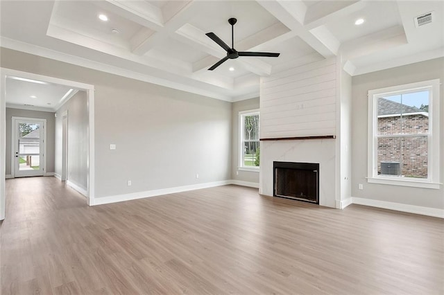 72701 Robindale Dr, Covington, LA 70435 - unfurnished living room featuring wood finished floors, coffered ceiling, a high end fireplace, beam ceiling, and ceiling fan