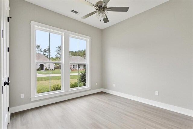 72701 Robindale Dr, Covington, LA 70435 - empty room with wood finished floors and ceiling fan