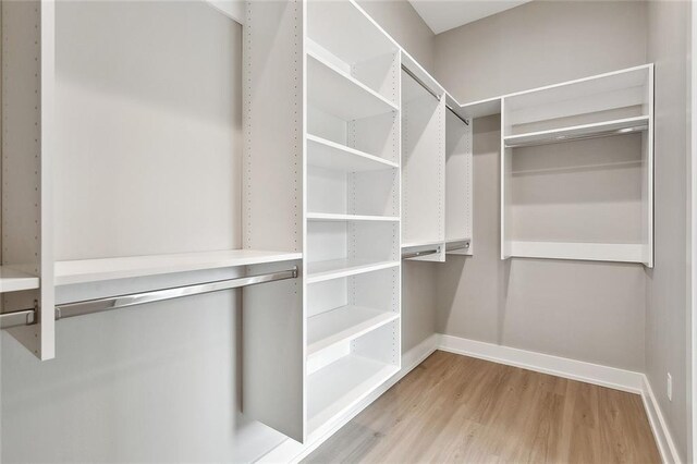 72701 Robindale Dr, Covington, LA 70435 - walk in closet featuring light wood-type flooring
