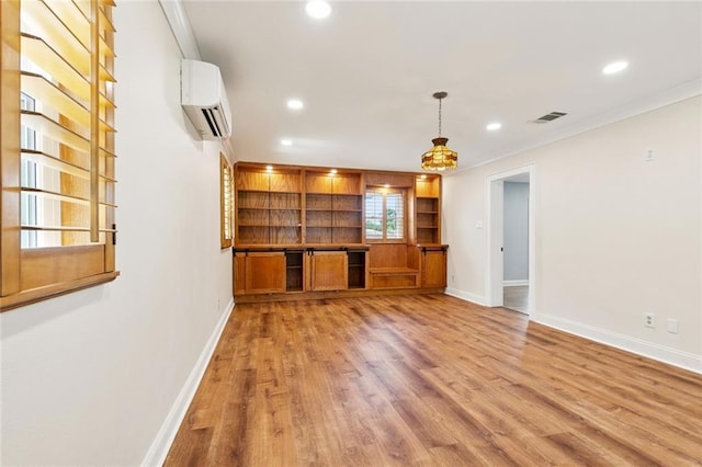 7032 Glenn St, Metairie, LA 70003 - unfurnished living room with recessed lighting, a wall mounted AC, light wood-style floors, and ornamental molding