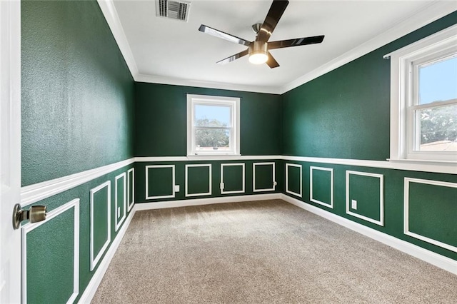 7032 Glenn St, Metairie, LA 70003 - carpeted spare room with ornamental molding, a ceiling fan, wainscoting, and a decorative wall