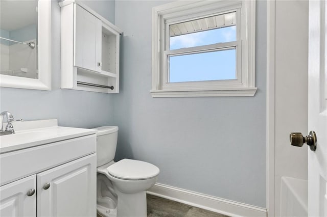 7032 Glenn St, Metairie, LA 70003 - full bathroom featuring vanity, wood finished floors, and shower / washtub combination