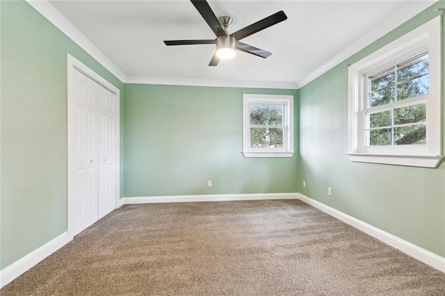 7032 Glenn St, Metairie, LA 70003 - unfurnished bedroom with ornamental molding, multiple windows, carpet, and a closet