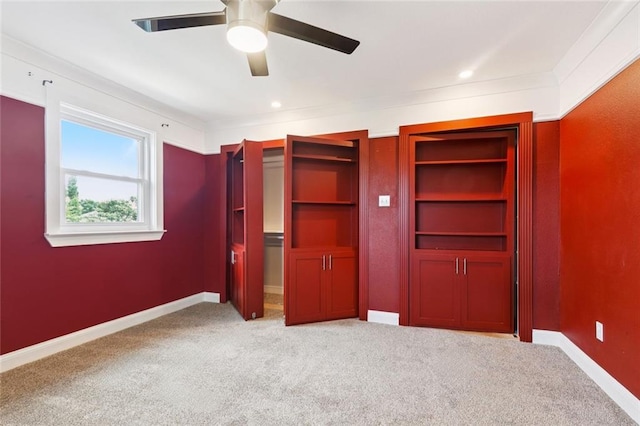7032 Glenn St, Metairie, LA 70003 - unfurnished bedroom with light colored carpet, a ceiling fan, and multiple closets