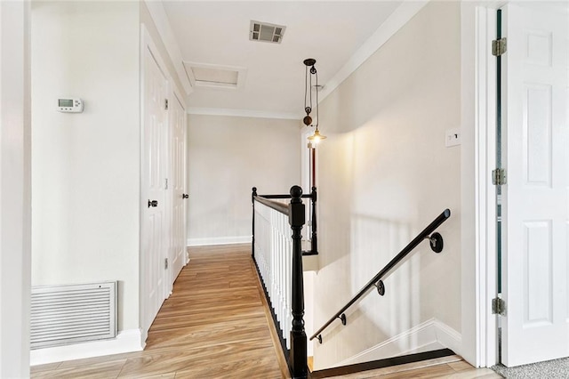 7032 Glenn St, Metairie, LA 70003 - stairway with attic access, wood finished floors, and crown molding