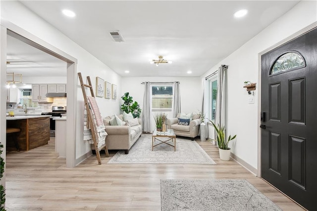 713 N Lester Ave, Metairie, LA 70003 - entrance foyer with light wood-type flooring and recessed lighting