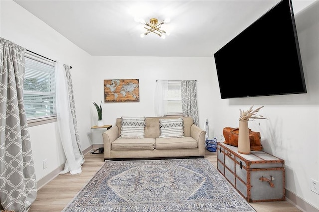 713 N Lester Ave, Metairie, LA 70003 - living room featuring light wood-style flooring and baseboards