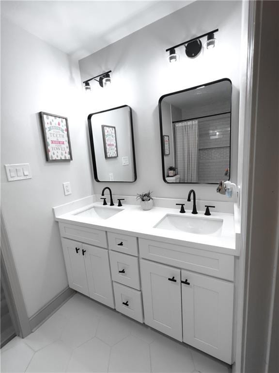 713 N Lester Ave, Metairie, LA 70003 - full bathroom with double vanity and tile patterned floors