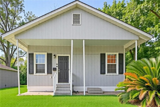 272 W Harrison St, Baton Rouge, LA 70802 - bungalow-style home with a front lawn and entry steps