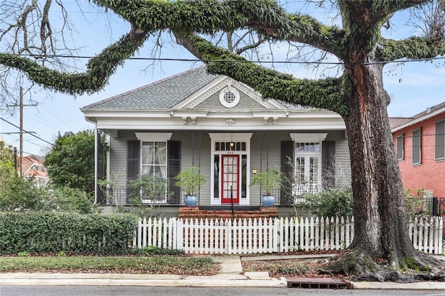 202 S Pierce St, New Orleans, LA 70119 - view of front of property featuring covered porch and a fenced front yard