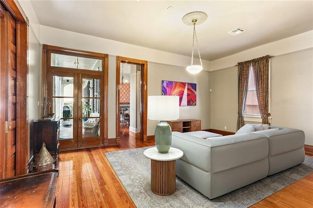 202 S Pierce St, New Orleans, LA 70119 - living room with french doors, plenty of natural light, and wood-type flooring