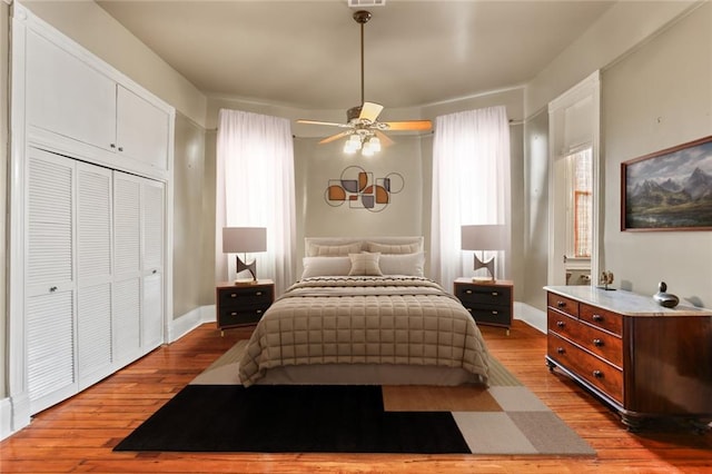 202 S Pierce St, New Orleans, LA 70119 - bedroom featuring hardwood / wood-style flooring, a closet, and a ceiling fan