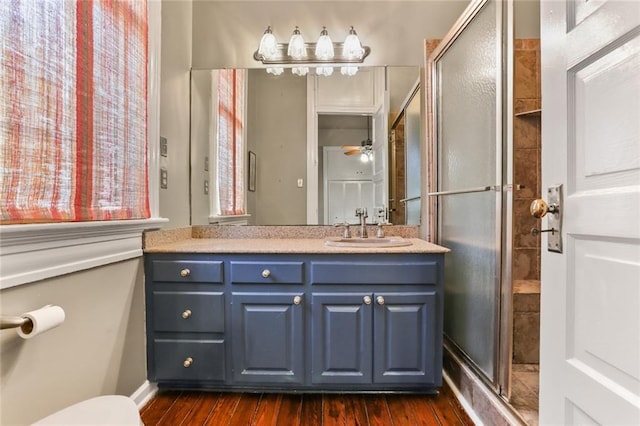 202 S Pierce St, New Orleans, LA 70119 - full bathroom featuring vanity, a shower stall, wood finished floors, and a ceiling fan