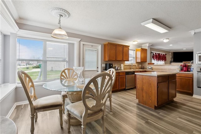 1111 Artesa Dr, Marrero, LA 70072 - dining area featuring ornamental molding, a textured ceiling, and light wood-style floors