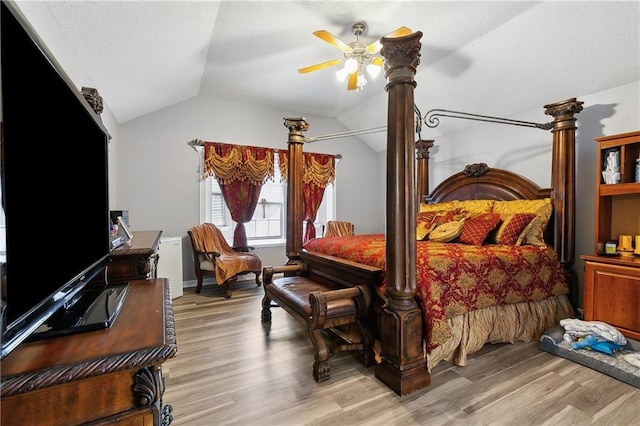 1111 Artesa Dr, Marrero, LA 70072 - bedroom with lofted ceiling, light wood-style flooring, a textured ceiling, and ceiling fan