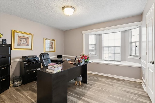 1111 Artesa Dr, Marrero, LA 70072 - office area featuring a textured ceiling and wood finished floors