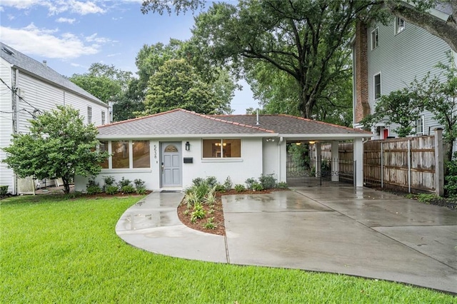 5538 Bellaire Dr, New Orleans, LA 70124 - view of front of property with driveway, roof with shingles, and a carport