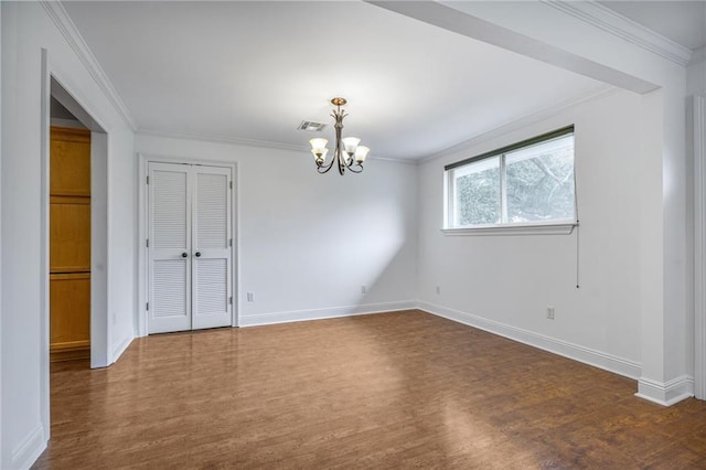 5538 Bellaire Dr, New Orleans, LA 70124 - spare room with dark wood-style floors, a chandelier, and crown molding