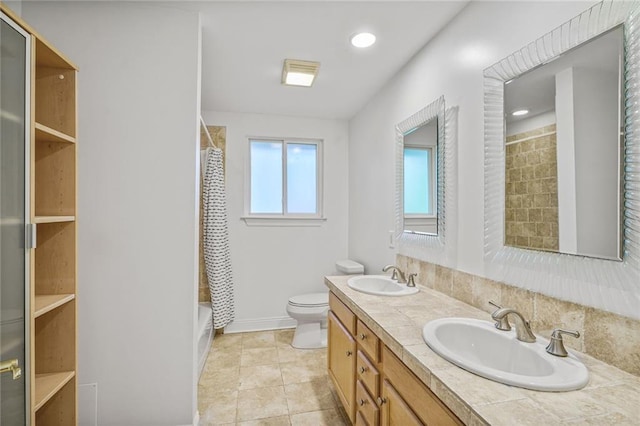 5538 Bellaire Dr, New Orleans, LA 70124 - full bath with double vanity, a shower with shower curtain, tile patterned flooring, and recessed lighting