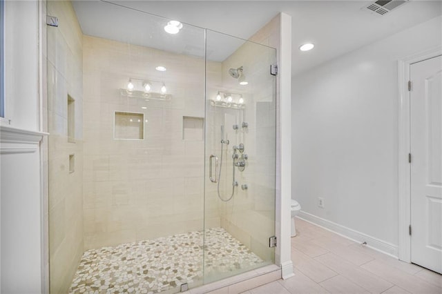 5538 Bellaire Dr, New Orleans, LA 70124 - bathroom with a stall shower, tile patterned flooring, and recessed lighting