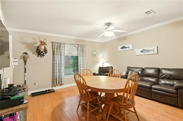 5191 Arlington Ct, Baton Rouge, LA 70820 - dining room with a ceiling fan, light wood-type flooring, and ornamental molding
