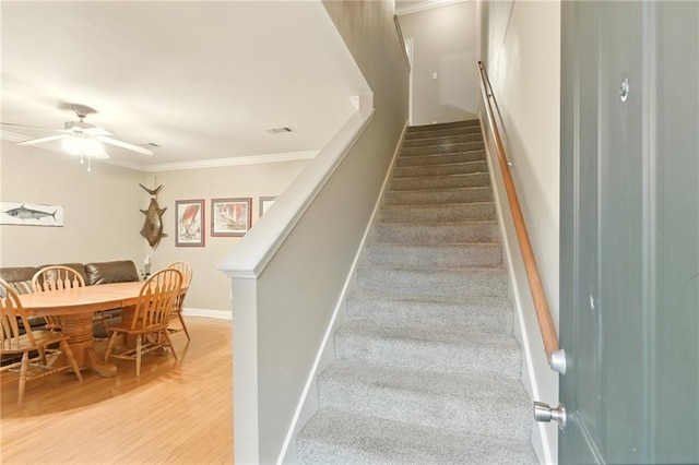 5191 Arlington Ct, Baton Rouge, LA 70820 - stairway with crown molding, wood finished floors, and a ceiling fan