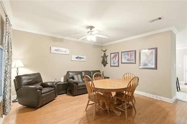 5191 Arlington Ct, Baton Rouge, LA 70820 - dining room featuring light wood-type flooring, crown molding, and a ceiling fan