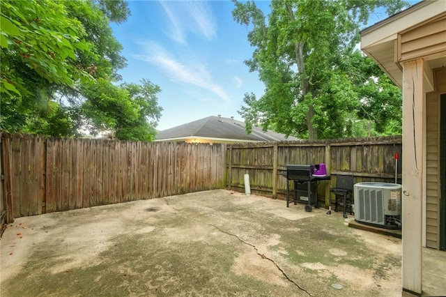5191 Arlington Ct, Baton Rouge, LA 70820 - fenced backyard featuring a patio area and area for grilling