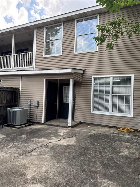 5191 Arlington Ct, Baton Rouge, LA 70820 - rear view of property featuring a patio area and a balcony