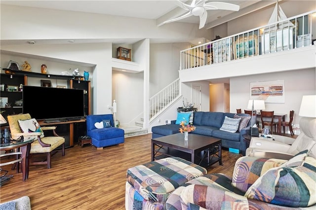 105 Mariners Is Unit 105, Mandeville, LA 70448 - living area featuring wood finished floors, stairway, a ceiling fan, beam ceiling, and high vaulted ceiling