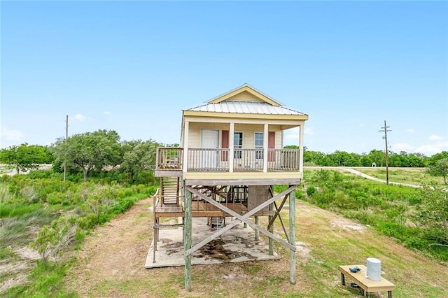 24092 Chef Menteur Hwy, New Orleans, LA 70129 - rear view of house featuring a metal roof