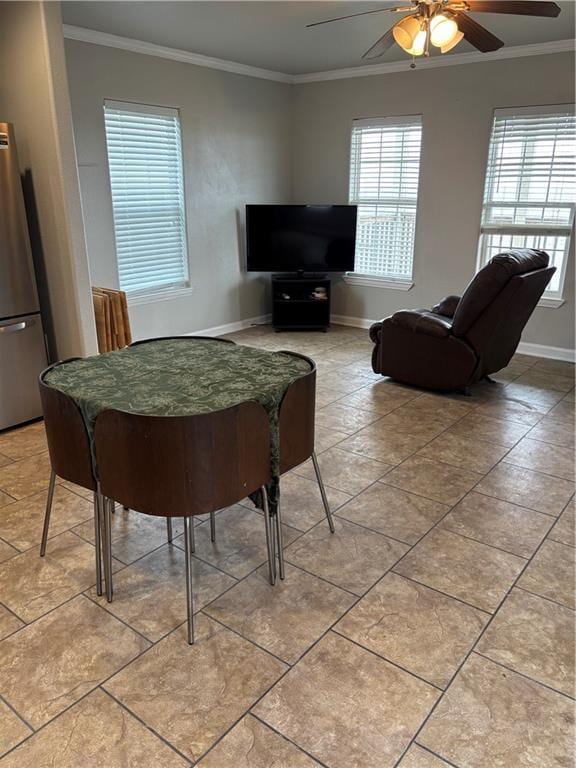 24092 Chef Menteur Hwy, New Orleans, LA 70129 - dining area featuring a ceiling fan, crown molding, plenty of natural light, and light tile patterned floors