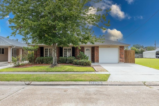 1729 High Ave, Metairie, LA 70001 - single story home featuring an attached garage, driveway, and brick siding