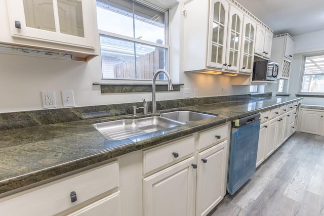 1729 High Ave, Metairie, LA 70001 - kitchen featuring dishwasher, black microwave, light wood-style floors, glass insert cabinets, and white cabinets
