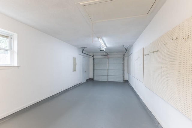 1729 High Ave, Metairie, LA 70001 - garage featuring a garage door opener and electric panel
