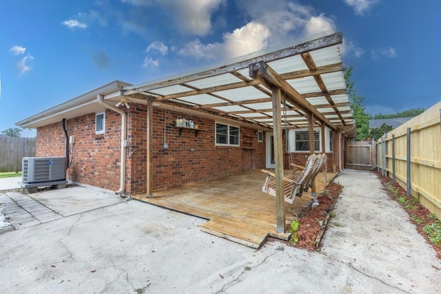 1729 High Ave, Metairie, LA 70001 - back of property with brick siding, a fenced backyard, and a deck