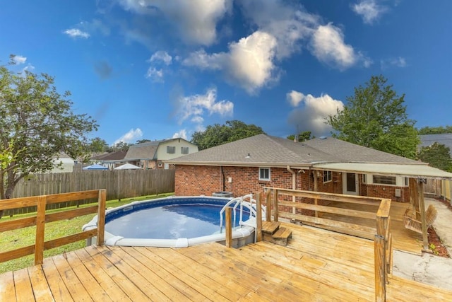 1729 High Ave, Metairie, LA 70001 - view of swimming pool featuring a wooden deck and a fenced backyard