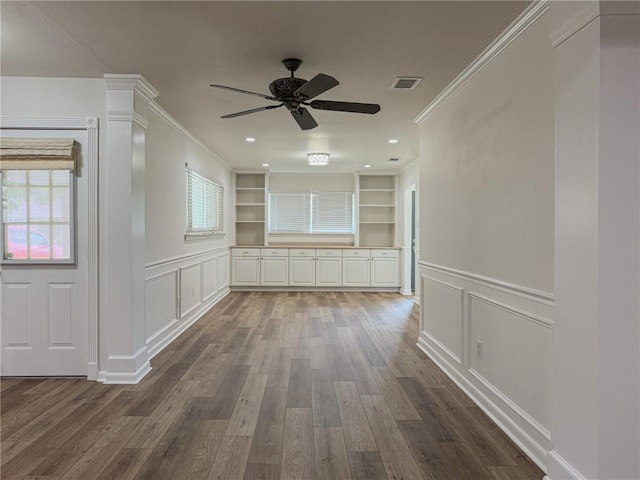 1904 Hall Ave, Metairie, LA 70003 - unfurnished room with a decorative wall, ornamental molding, ceiling fan, dark wood-style floors, and built in features