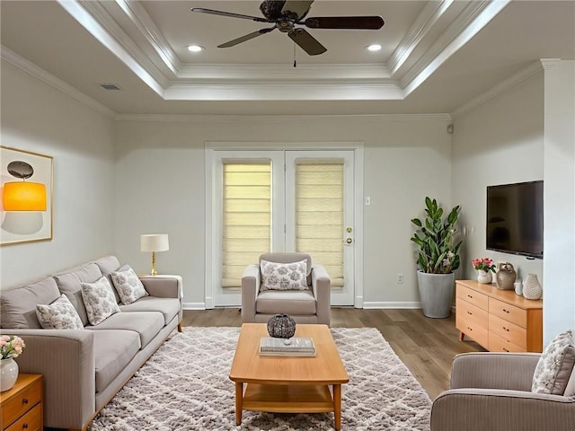 1904 Hall Ave, Metairie, LA 70003 - living room with a raised ceiling, ceiling fan, wood finished floors, and crown molding