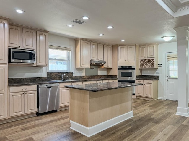 1904 Hall Ave, Metairie, LA 70003 - kitchen featuring stainless steel appliances, under cabinet range hood, light wood finished floors, a center island, and recessed lighting