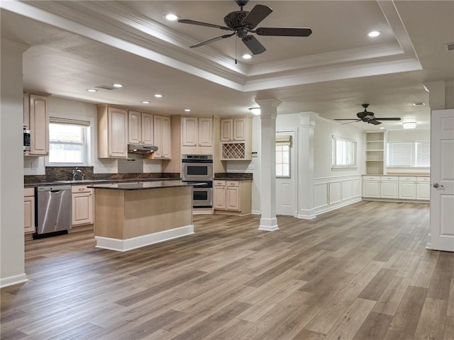 1904 Hall Ave, Metairie, LA 70003 - kitchen with stainless steel appliances, a raised ceiling, ceiling fan, ornamental molding, and light wood finished floors