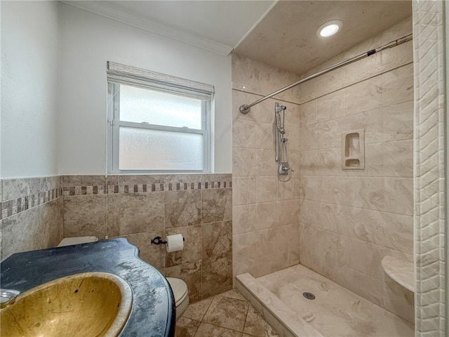 1904 Hall Ave, Metairie, LA 70003 - full bath featuring a tile shower, ornamental molding, tile walls, tile patterned flooring, and vanity