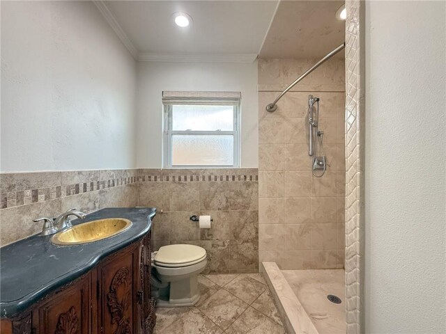 1904 Hall Ave, Metairie, LA 70003 - full bath with vanity, tile patterned floors, ornamental molding, a tile shower, and tile walls