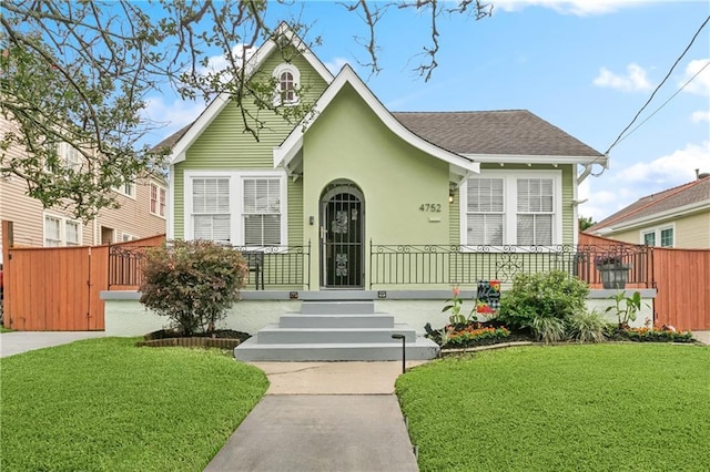 4752 Demontluzin St, New Orleans, LA 70122 - view of front of home with stucco siding and a shingled roof
