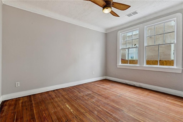 4752 Demontluzin St, New Orleans, LA 70122 - unfurnished room with ceiling fan, hardwood / wood-style floors, crown molding, and a textured ceiling