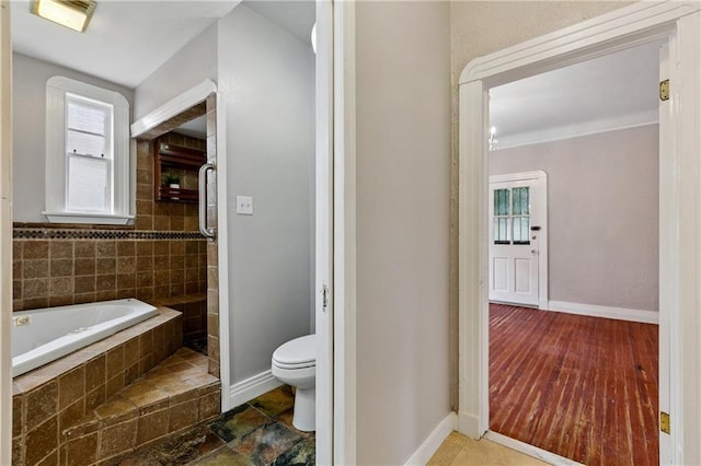 4752 Demontluzin St, New Orleans, LA 70122 - full bathroom featuring toilet and a garden tub