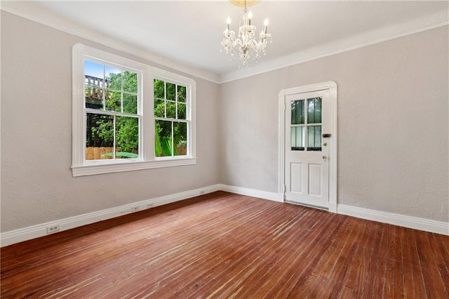 4752 Demontluzin St, New Orleans, LA 70122 - unfurnished room featuring a chandelier and hardwood / wood-style flooring