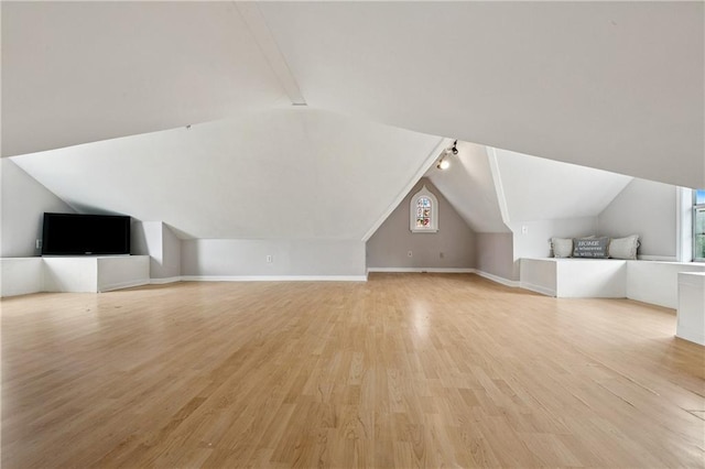 4752 Demontluzin St, New Orleans, LA 70122 - additional living space with lofted ceiling and light wood-type flooring